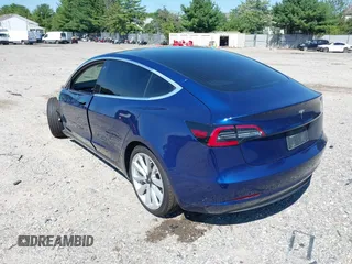 2019 Tesla Model 3 Mid Range with VIN 5YJ3E1EA6KF402308, listed as a IAAI auction lot 40077902 with 89,794 mi miles and . Bid and sale history available at carsss.com. Image 3.
