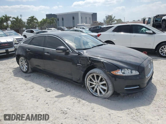 2012 Jaguar XJ with VIN SAJWA1CB5CLV27448, listed as a Copart auction lot 53373985 with 90,603 mi miles and Salvage Title. Bid and sale history available at DreamBid. Image 4.