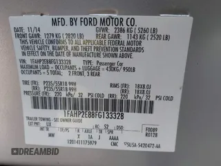 2015 Ford Taurus SEL z VIN 1FAHP2E88FG133328, wystawiony jako IAAI lot #42179649 z przebiegiem 127 171 mil mil oraz . Historia ofert i sprzedaży dostępna na DreamBid. Obrazek 9.