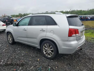 2011 Kia Sorento SX with VIN 5XYKW4A2XBG099857, listed as a Copart auction lot 56946015 with 195,457 mi miles and Salvage title. Bid and sale history available at DreamBid. Image 2.