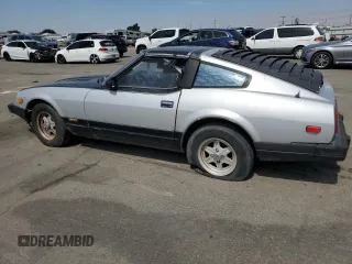 1982 Datsun 280ZX z VIN JN1HZ04SXCX448748, wystawiony jako Copart lot #87670125 z przebiegiem 136 264 mil mil oraz Szkody całkowita. Historia ofert i sprzedaży dostępna na DreamBid. Obrazek 2.
