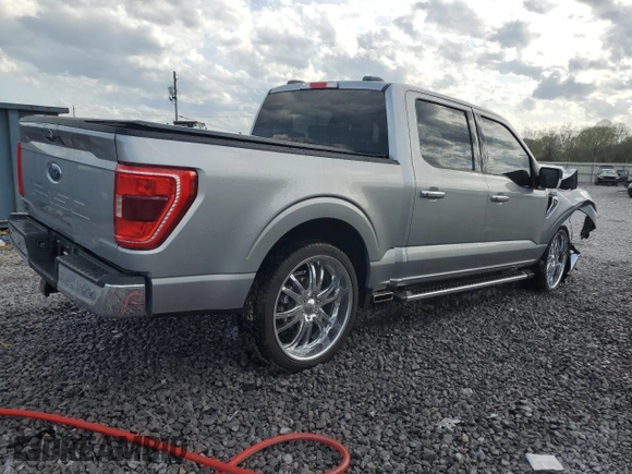 2023 Ford F-150 XL with VIN 1FTEW1C50PKF91124, listed as a Copart auction lot 51538865 with 22,128 mi miles and Salvage title. Bid and sale history available at DreamBid. Image 3.