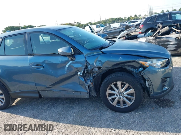 2016 Mazda CX-5 Sport with VIN JM3KE2BY8G0864983, listed as a IAAI auction lot 42072385 with 141,104 mi miles. Bid and sale history available at carsss.com. Image 6.