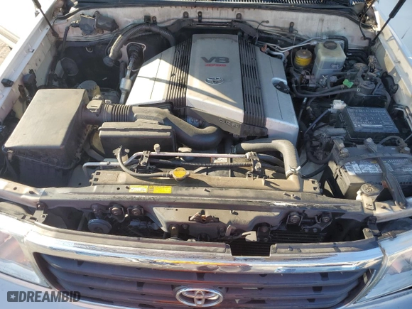 1999 Toyota Land Cruiser with VIN JT3HT05J8X0049750, listed as a Copart auction lot 77547144 with 168,435 mi miles and Salvage Title. Bid and sale history available at carsss.com. Image 12.