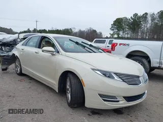 2014 Lincoln MKZ z VIN 3LN6L2GK4ER828656, wystawiony jako IAAI lot #41285297 z przebiegiem 102 513 mil mil oraz . Historia ofert i sprzedaży dostępna na DreamBid. Obrazek 1.