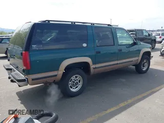 1995 Chevrolet Suburban with VIN 1GNGK26N9SJ397588, listed as a IAAI auction lot 42114009 with 238,914 mi miles. Bid and sale history available at carsss.com. Image 4.