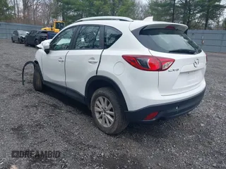 2014 Mazda CX-5 Sport with VIN JM3KE4BE3E0300849, listed as a IAAI auction lot 41942418 with 144,310 mi miles. Bid and sale history available at carsss.com. Image 3.