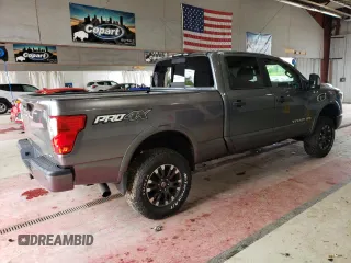 2016 Nissan Titan XD PRO-4X with VIN 1N6BA1F46GN501801, listed as a Copart auction lot 63231474 with 127,728 mi miles and Clean Title. Bid and sale history available at carsss.com. Image 3.