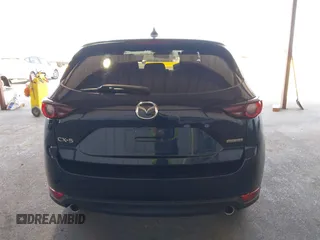 2020 Mazda CX-5 Touring z VIN JM3KFACM2L0802461, wystawiony jako IAAI lot #42148039 z przebiegiem 57 963 mil mil oraz . Historia ofert i sprzedaży dostępna na DreamBid. Obrazek 17.