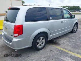 2012 Dodge Grand Caravan SXT with VIN 2C4RDGCG3CR308173, listed as a IAAI auction lot 42255879 with 96,489 mi miles and . Bid and sale history available at DreamBid. Image 4.