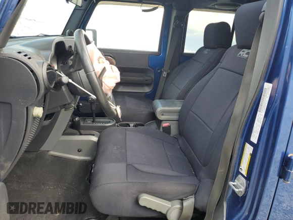 2009 Jeep Wrangler Unlimited Rubicon with VIN 1J4GA69169L762992, listed as a Copart auction lot 51674355 with 147,181 mi miles and Salvage title. Bid and sale history available at DreamBid. Image 7.