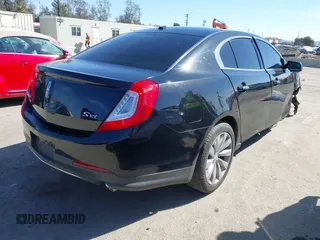 2014 Lincoln MKS with VIN 1LNHL9DK7EG608912, listed as a IAAI auction lot 41722004 with 211,051 mi miles. Bid and sale history available at carsss.com. Image 4.