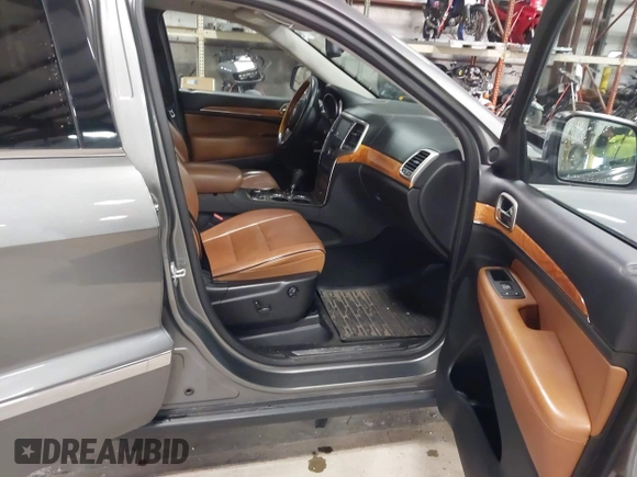 2013 Jeep Grand Cherokee Overland with VIN 1C4RJFCT9DC524605, listed as a IAAI auction lot 42016103 with 215,352 mi miles. Bid and sale history available at carsss.com. Image 5.