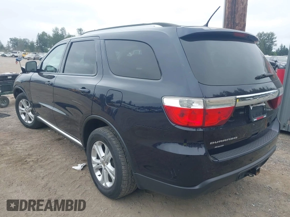2013 Dodge Durango SXT with VIN 1C4RDJAG5DC697022, listed as a IAAI auction lot 42474060 with 159,723 mi miles and . Bid and sale history available at DreamBid. Image 3.