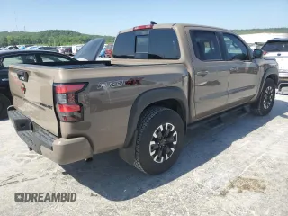 2023 Nissan Frontier Pro-4X with VIN 1N6ED1EK0PN668109, listed as a Copart auction lot 57064975 with 6,406 mi miles and Salvage title. Bid and sale history available at DreamBid. Image 3.