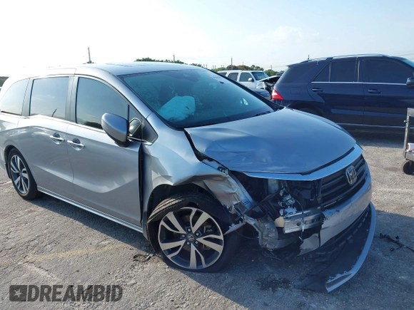 2023 Honda Odyssey Touring with VIN 5FNRL6H86PB020700, listed as a IAAI auction lot 41961098 with 66,512 mi miles and . Bid and sale history available at DreamBid. Image 6.