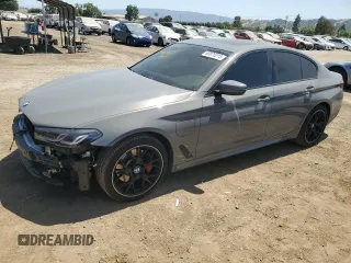 2021 BMW 5 Series 530e with VIN WBA13AG0XMCG70182, listed as a Copart auction lot 60876215 with 74,742 mi miles and Salvage title. Bid and sale history available at DreamBid. Image 1.