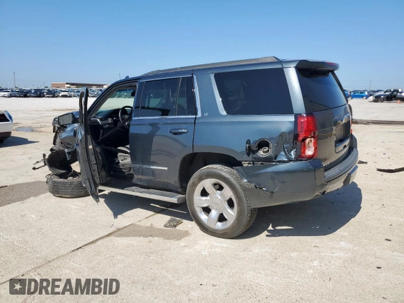 2019 Chevrolet Tahoe LT with VIN 1GNSCBKC0KR273948, listed as a Copart auction lot 61309785 with 155,428 mi miles and Salvage title. Bid and sale history available at DreamBid. Image 2.