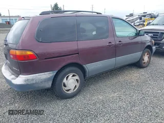 1999 Toyota Sienna LE with VIN 4T3ZF13C7XU152879, listed as a IAAI auction lot 41974953 with 201,644 mi miles. Bid and sale history available at carsss.com. Image 4.