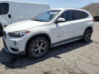 2018 BMW X1 sDrive28i z VIN WBXHU7C3XJ5H45693, wystawiony jako Copart lot #57506305 z przebiegiem 181 636 mil mil oraz Tytuł czysty. Historia ofert i sprzedaży dostępna na DreamBid. Obrazek 1.