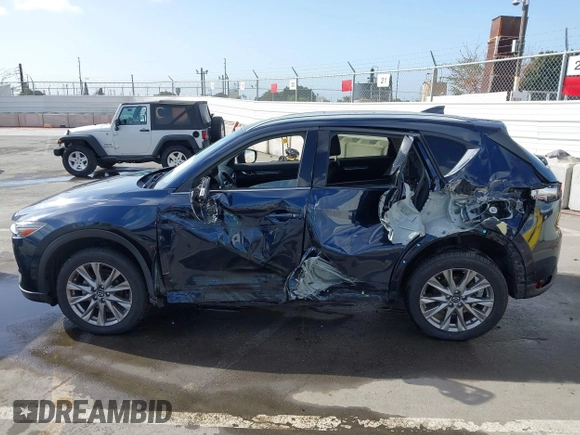 2021 Mazda CX-5 Grand Touring with VIN JM3KFBDM6M1312573, listed as a IAAI auction lot 41936739 with Not Provided miles and . Bid and sale history available at DreamBid. Image 13.
