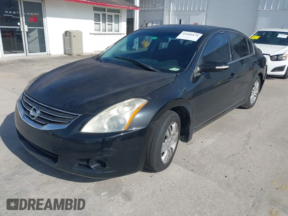2010 Nissan Altima S with VIN 1N4AL2AP0AC111558, listed as a IAAI auction lot 42084874 with 221,760 mi miles and . Bid and sale history available at carsss.com. Image 2.