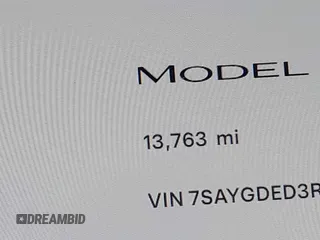 2024 Tesla Model Y with VIN 7SAYGDED3RF019063, listed as a IAAI auction lot 42061888 with 13,763 mi miles and . Bid and sale history available at DreamBid. Image 14.