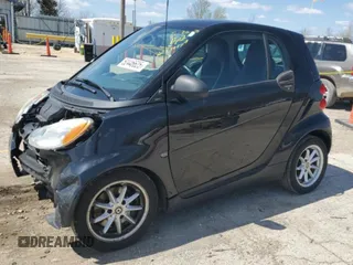 2009 Smart fortwo Pure z VIN WMEEJ31X49K219479, wystawiony jako Copart lot #52446625 z przebiegiem 82 337 mil mil oraz Szkody całkowita. Historia ofert i sprzedaży dostępna na DreamBid. Obrazek 1.