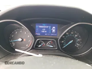 2013 Ford Focus SE z VIN 1FADP3F25DL204052, wystawiony jako Copart lot #57662695 z przebiegiem 124 916 mil mil oraz Szkoda całkowita • Salvage title. Historia ofert i sprzedaży dostępna na DreamBid. Obrazek 9.