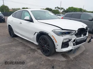 2021 BMW X6 xDrive40i with VIN 5UXCY6C00M9F88215, listed as a IAAI auction lot 41646498 with 43,587 mi miles. Bid and sale history available at carsss.com. Image 1.