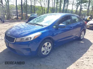 2017 Kia Forte LX with VIN 3KPFK4A70HE052223, listed as a IAAI auction lot 42036382 with 136,671 mi miles. Bid and sale history available at carsss.com. Image 2.