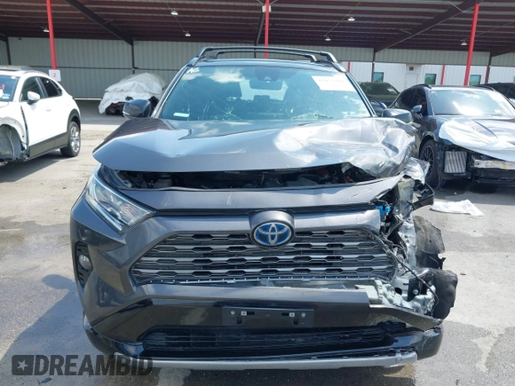 2021 Toyota RAV4 Hybrid XSE with VIN 2T3E6RFV8MW026973, listed as a IAAI auction lot 42052289 with 94,857 mi miles and . Bid and sale history available at DreamBid. Image 12.