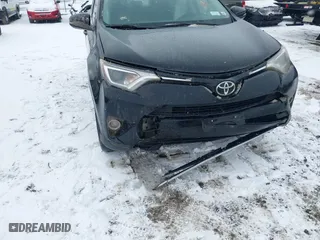2018 Toyota RAV4 XLE with VIN 2T3RFREV8JW851250, listed as a IAAI auction lot 41164994 with 63,005 mi miles. Bid and sale history available at carsss.com. Image 6.
