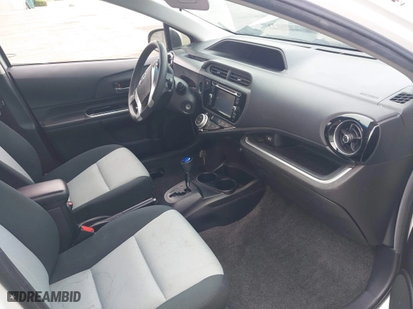 2015 Toyota Prius c One with VIN JTDKDTB3XF1097538, listed as a IAAI auction lot 42031057 with 100,847 mi miles. Bid and sale history available at carsss.com. Image 5.