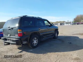 2005 GMC Yukon Denali z VIN 1GKEK63U55J254214, wystawiony jako IAAI lot #42103378 z przebiegiem 131 183 mil mil oraz . Historia ofert i sprzedaży dostępna na DreamBid. Obrazek 4.