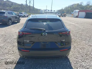 2023 Mazda CX-30 S Carbon Edition with VIN 3MVDMBCM1PM509987, listed as a IAAI auction lot 42060833 with 14,140 mi miles and . Bid and sale history available at DreamBid. Image 16.