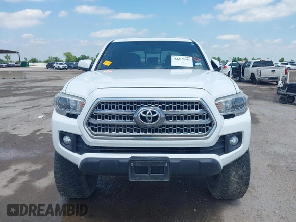 2017 Toyota Tacoma SR5 z VIN 5TFCZ5AN9HX070030, wystawiony jako IAAI lot #42212141 z przebiegiem 92 291 mil mil oraz . Historia ofert i sprzedaży dostępna na DreamBid. Obrazek 12.