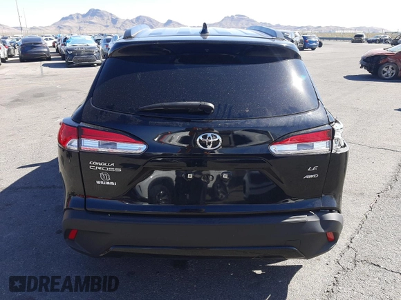2022 Toyota Corolla Cross LE with VIN 7MUCAABG1NV033299, listed as a Copart auction lot 58018825 with 28,138 mi miles and Salvage title. Bid and sale history available at DreamBid. Image 6.