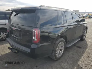 2019 GMC Yukon SLE with VIN 1GKS1AKC2KR101675, listed as a Copart auction lot 87256804 with 144,572 mi miles and Salvage Title. Bid and sale history available at carsss.com. Image 3.