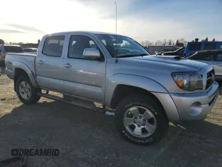2011 Toyota Tacoma PreRunner with VIN 3TMJU4GN7BM114871, listed as a Copart auction lot 87256214 with 214,236 mi miles and Salvage Title. Bid and sale history available at DreamBid. Image 4.