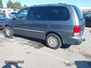 2002 Kia Sedona LX with VIN KNDUP131826297204, listed as a IAAI auction lot 41510393 with 136,337 mi miles. Bid and sale history available at carsss.com. Image 3.