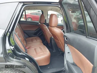 2014 Mazda CX-5 Touring with VIN JM3KE2CY7E0341658, listed as a IAAI auction lot 41915807 with 99,287 mi miles. Bid and sale history available at carsss.com. Image 8.