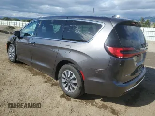2023 Chrysler Pacifica Hybrid Touring L with VIN 2C4RC1L79PR608659, listed as a Copart auction lot 56945365 with 45,697 mi miles and Salvage title. Bid and sale history available at DreamBid. Image 2.