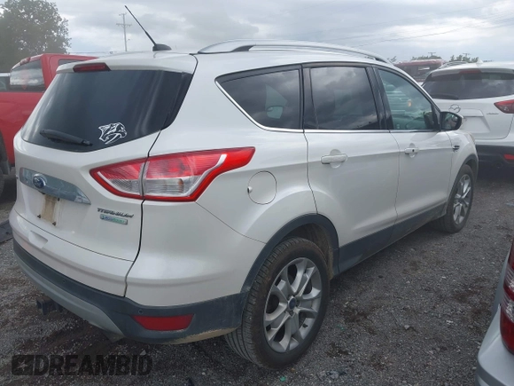 2015 Ford Escape Titanium with VIN 1FMCU0J99FUB92563, listed as a IAAI auction lot 42649556 with 183,199 mi miles and . Bid and sale history available at DreamBid. Image 4.