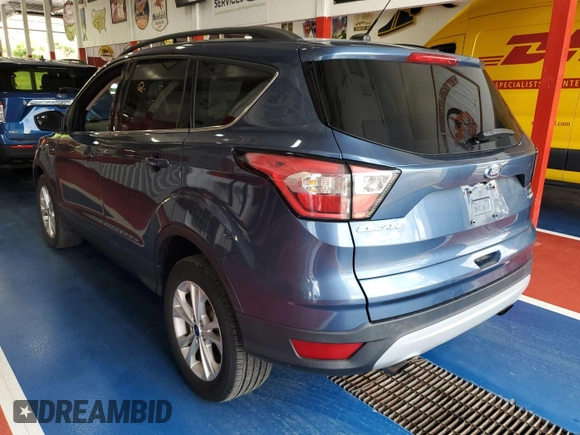 2018 Ford Escape SE z VIN 1FMCU9GD2JUA75853, wystawiony jako IAAI lot #42399997 z przebiegiem 89 772 mil mil oraz . Historia ofert i sprzedaży dostępna na DreamBid. Obrazek 9.