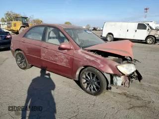 2005 Kia Spectra LX with VIN KNAFE122855108907, listed as a Copart auction lot 77502354 with Not Provided miles and Salvage Title. Bid and sale history available at carsss.com. Image 4.