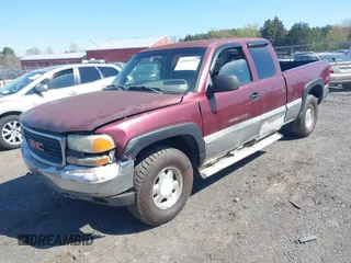 1999 GMC New Sierra 1500 SLE with VIN 2GTEK19T3X1525779, listed as a IAAI auction lot 41986559 with 254,123 mi miles. Bid and sale history available at carsss.com. Image 2.