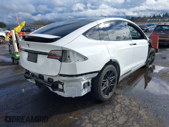 2022 Tesla Model X with VIN 7SAXCDE56NF360208, listed as a IAAI auction lot 41576953 with 9,759 mi miles. Bid and sale history available at carsss.com. Image 4.