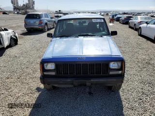 1996 Jeep Cherokee SE with VIN 1J4FT28S1TL108840, listed as a Copart auction lot 46951195 with 257,004 mi miles and Salvage Title. Bid and sale history available at carsss.com. Image 5.