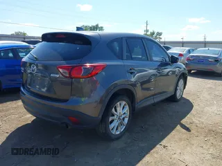 2014 Mazda CX-5 Grand Touring with VIN JM3KE2DY8E0383206, listed as a IAAI auction lot 40205756 with 120,231 mi miles. Bid and sale history available at carsss.com. Image 4.